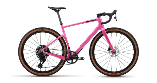 Pink gravel road bike with drop handlebars and disc wheels