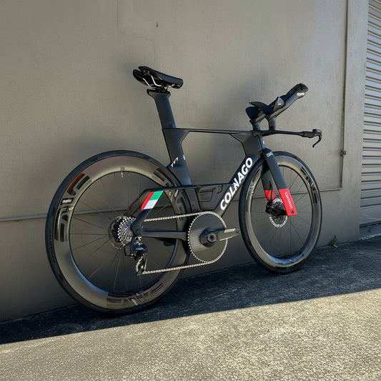 A Colnago TT1 time trial bicycle with deep carbon wheels