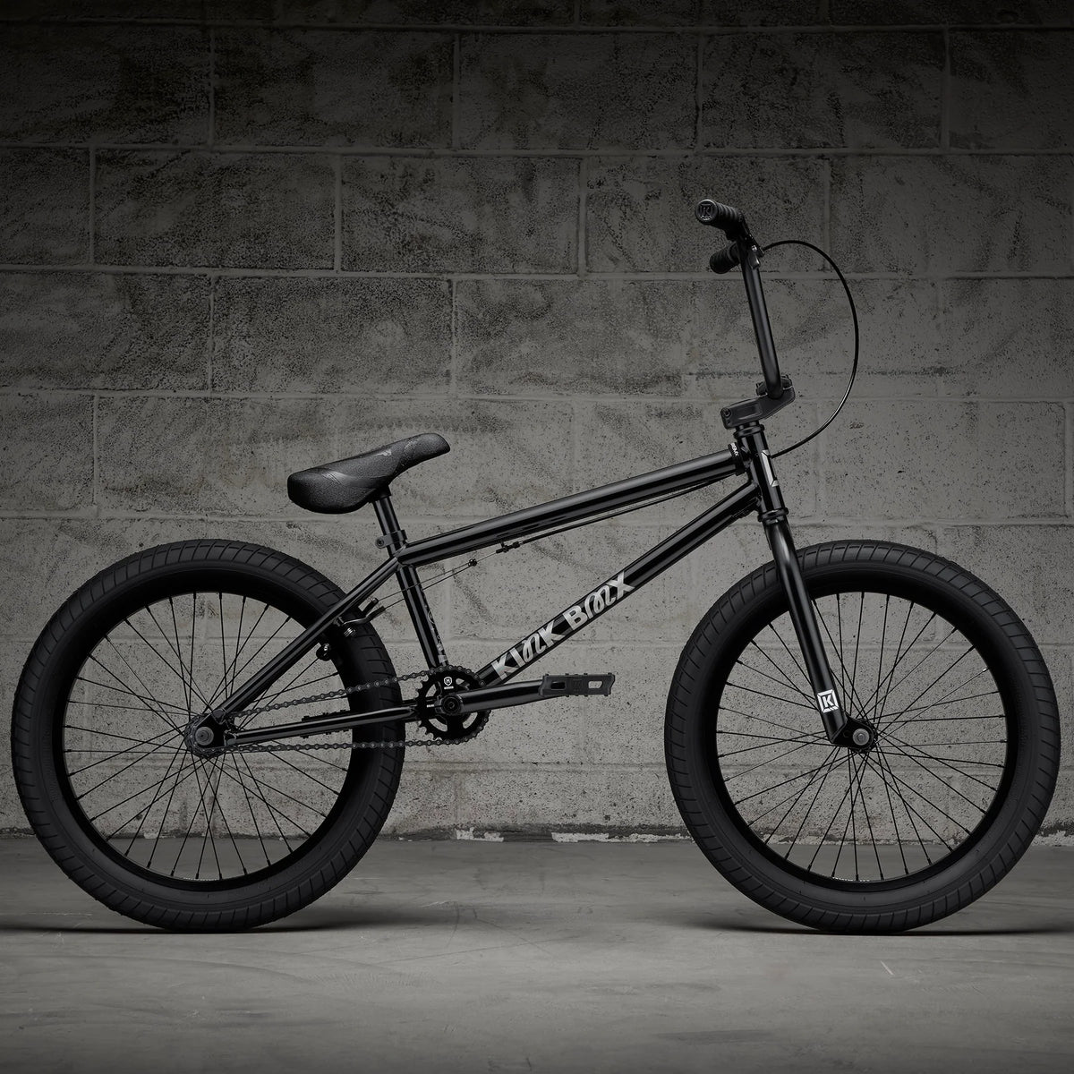 Black BMX bike, full side profile with handlebar and saddle