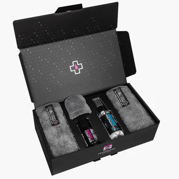 Muc-Off ceramic protection kit with bottles and gray microfiber cloths in open box