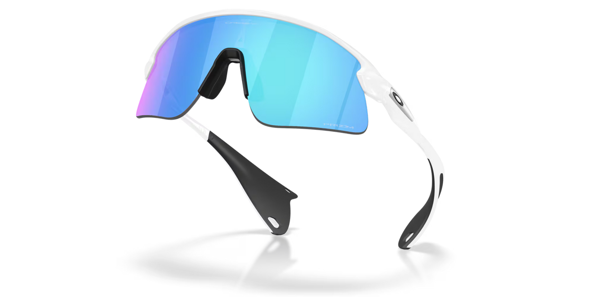 Oakley Stunt Devil sunglasses with matte white frames and blue-tinted lenses
