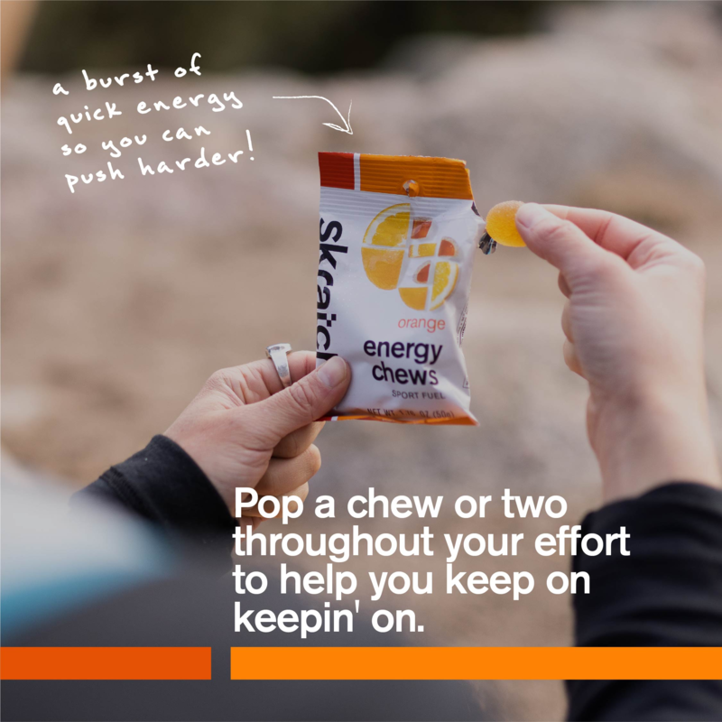Orange energy chew mini pouch held in hands, sport fuel chews