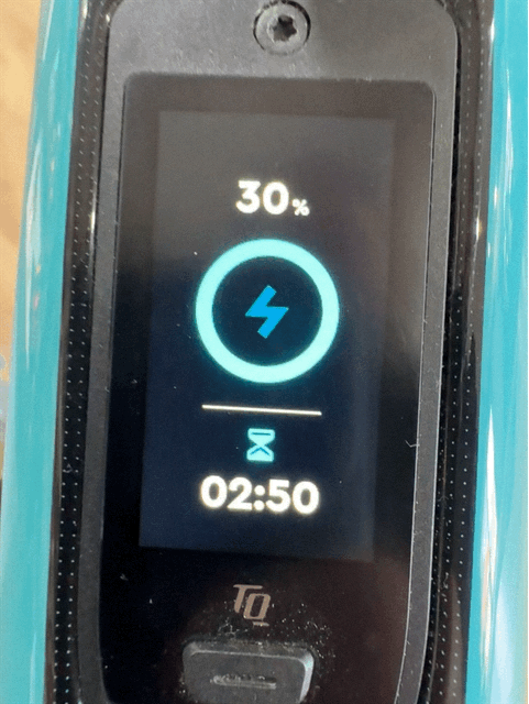 Close-up of black e-bike display showing 30% charge and a progress icon