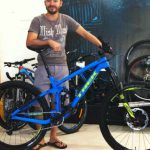 Man with bike — Bike Shop in Noosaville, QLD